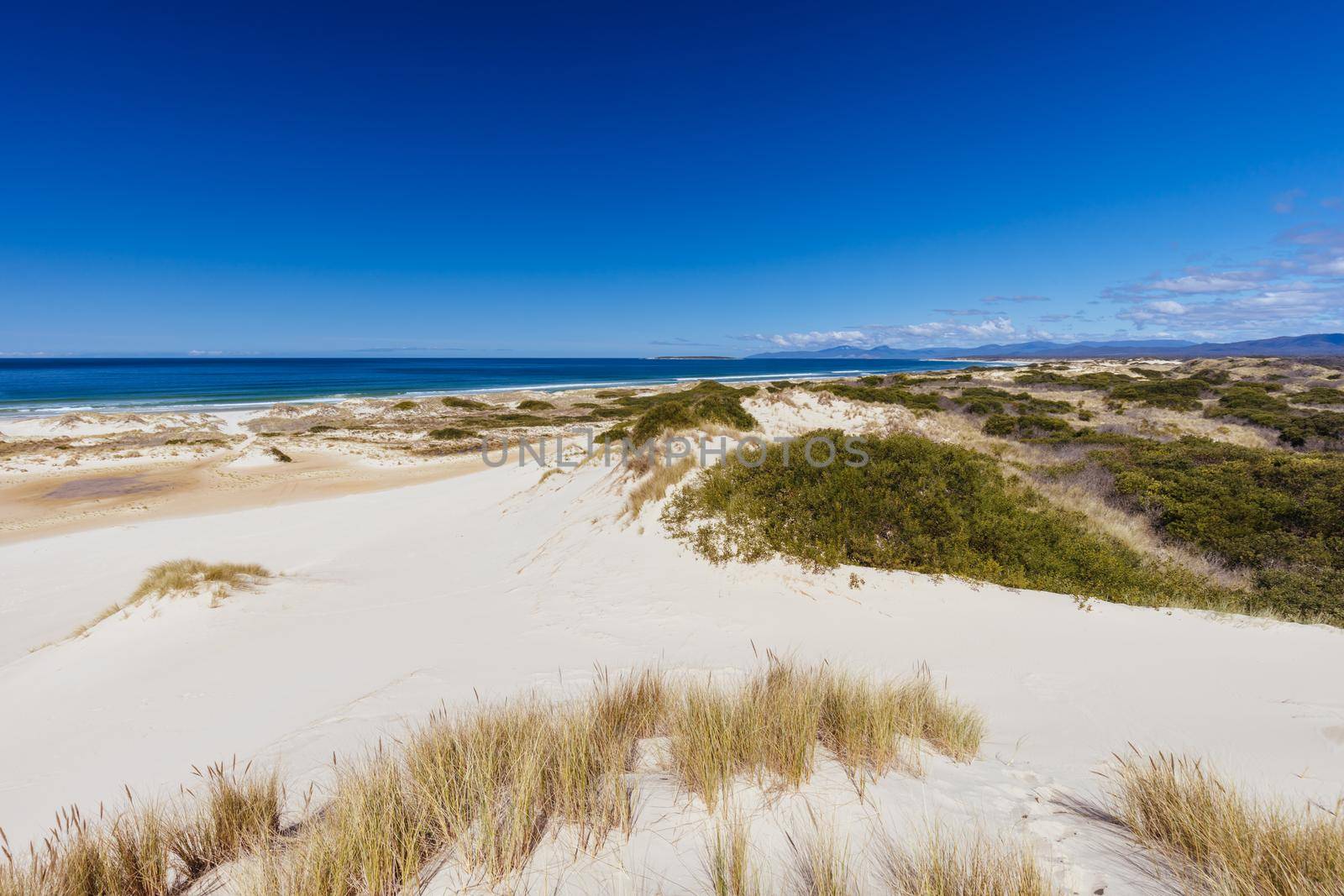 The popular Peron Dunes with 4WD driving in Akaroa, near St Helens in Tasmania, Australia