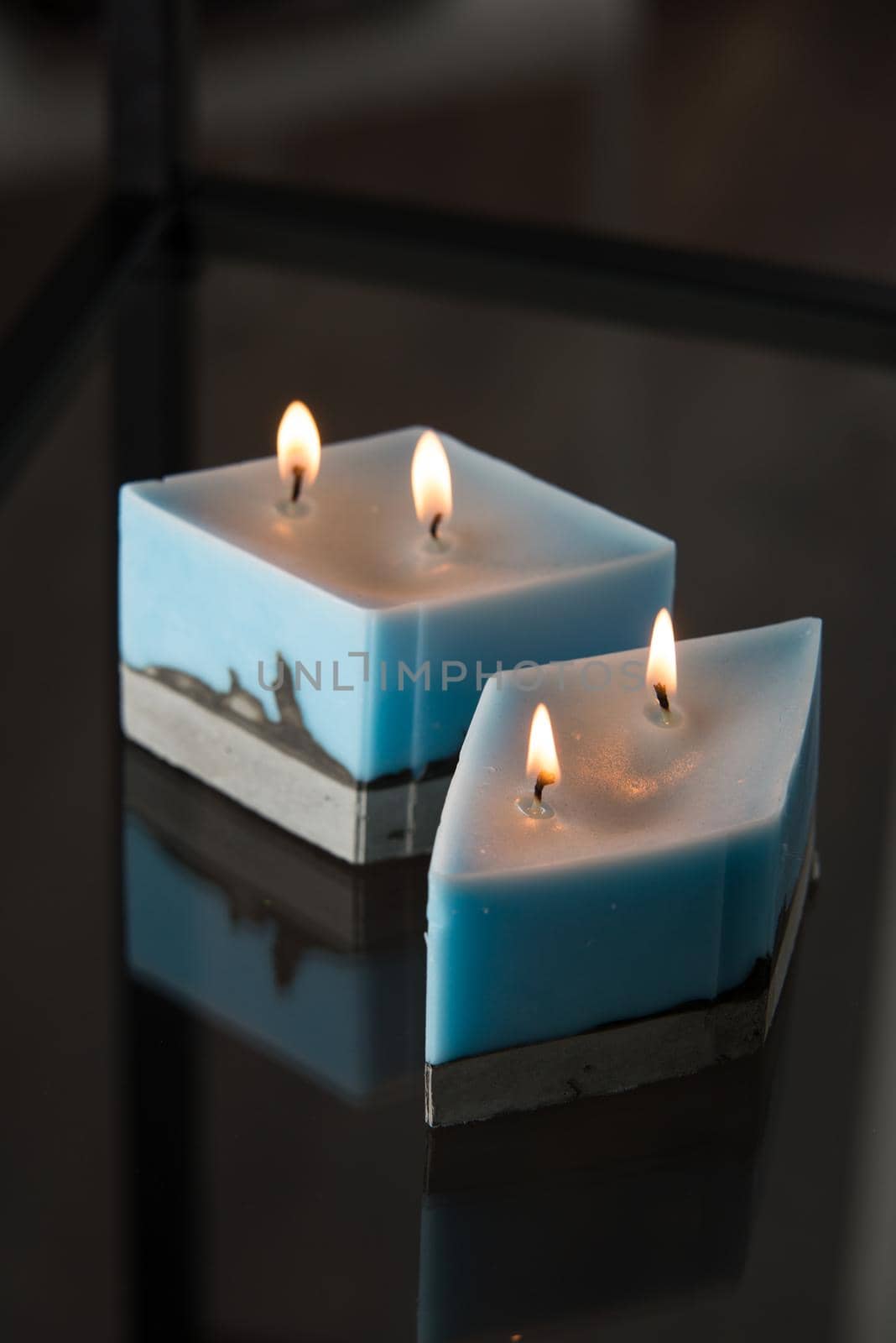 blue candle on a concrete base by Ashtray25