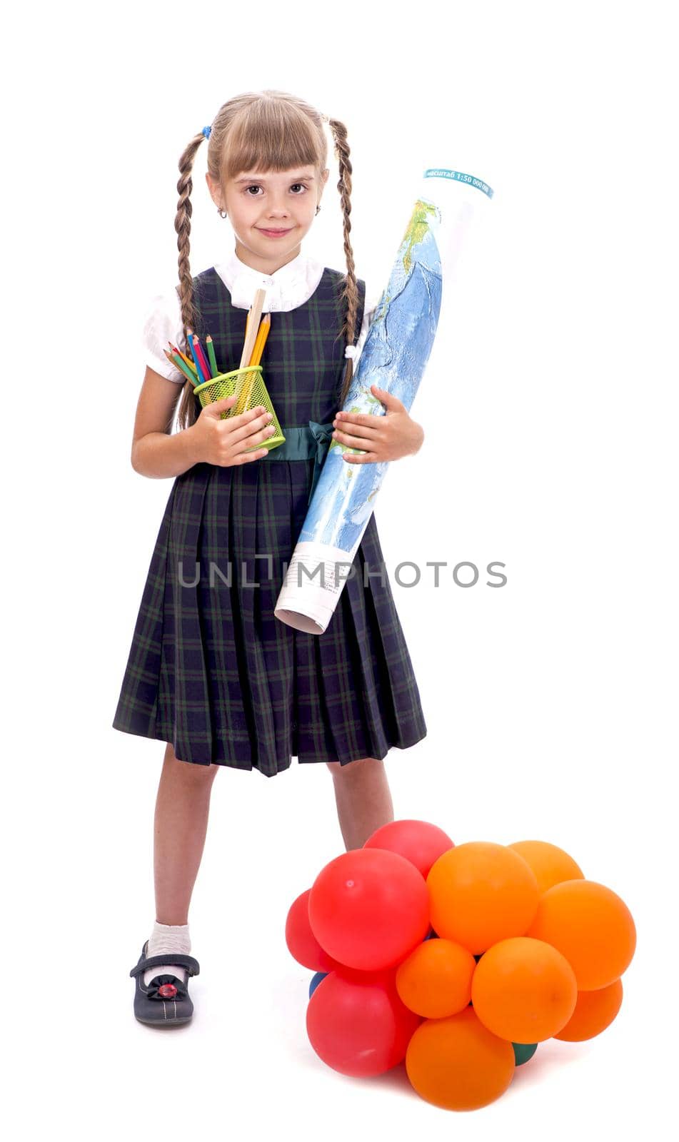 schoolgirl with balloons. Adorable little schoolgirl with a happy smile keeps her arms crossed. The little schoolgirl looks good in her school uniform. A pretty schoolgirl with long dark hair and a charming look. by aprilphoto