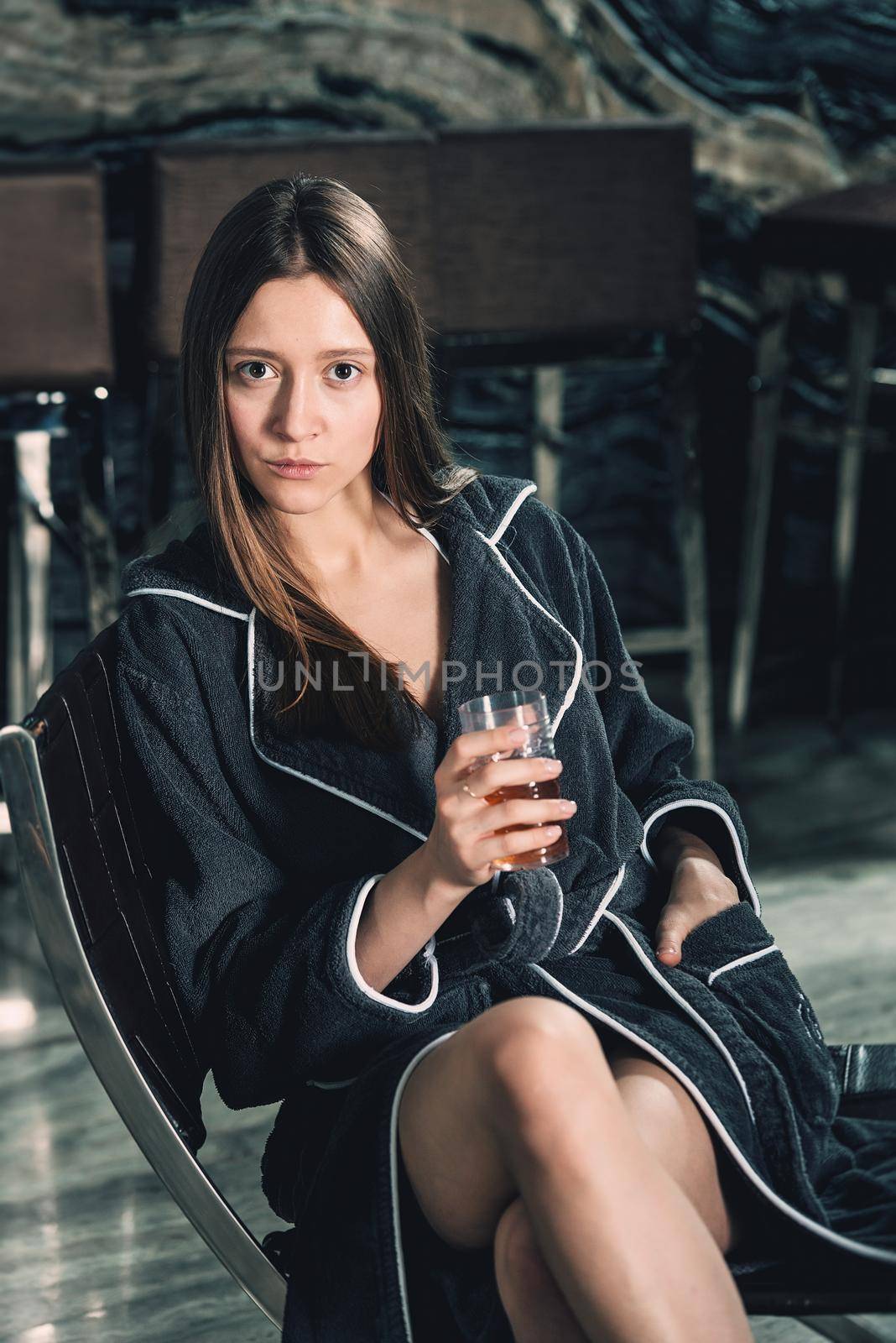 Beautiful woman relaxing in bathrobe in spa center by Ashtray25
