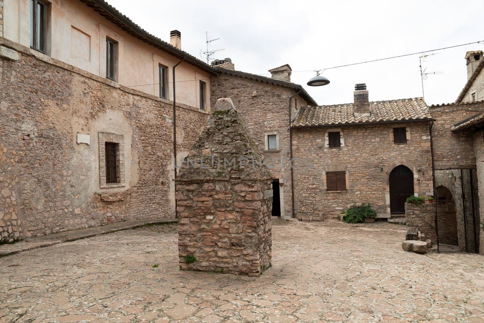 square with the well of Macerino, a historic town entirely made of stone, inhabited only in summer