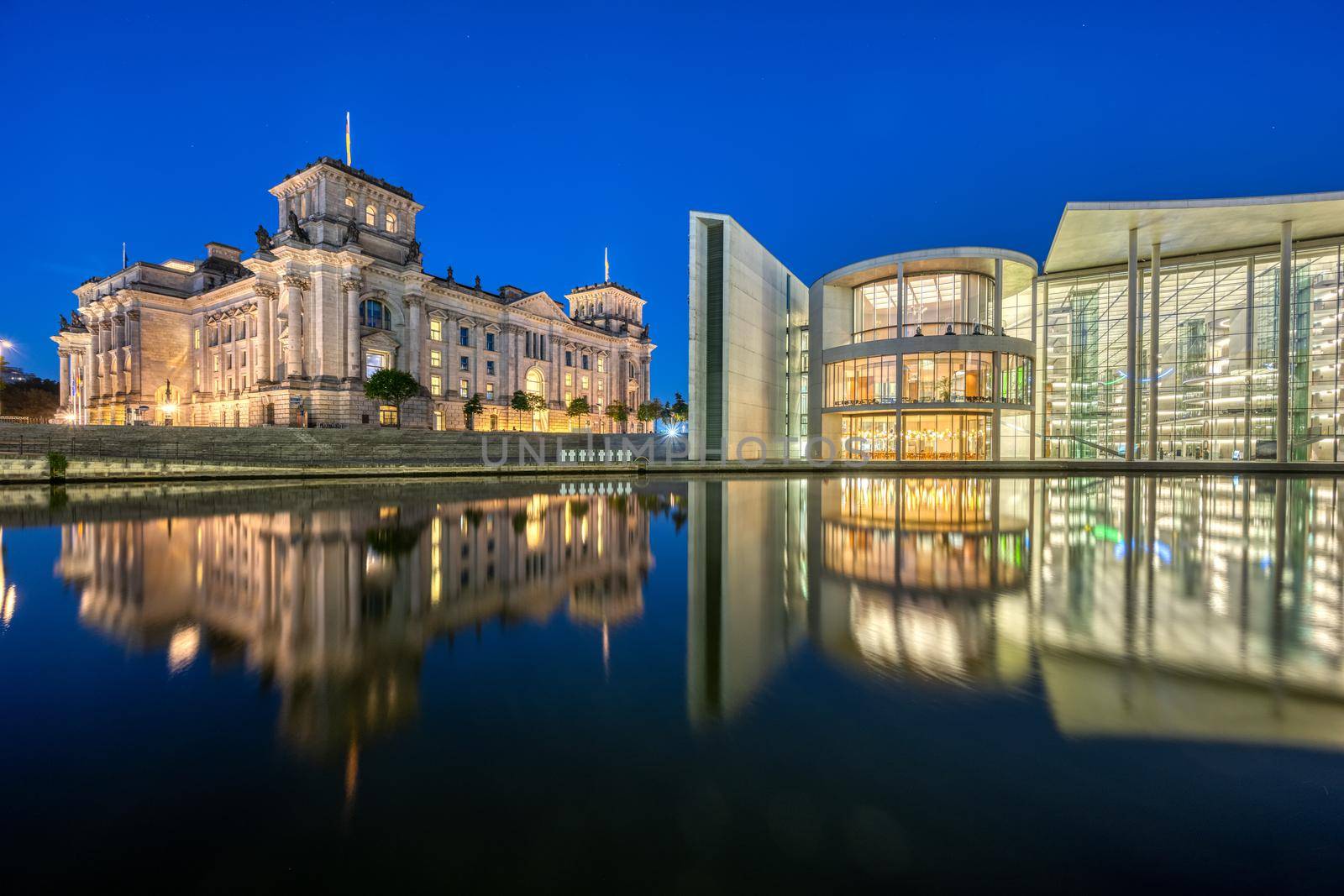 The Reichstag and the Paul-Loebe-Haus at the river Spree in Berlin at night