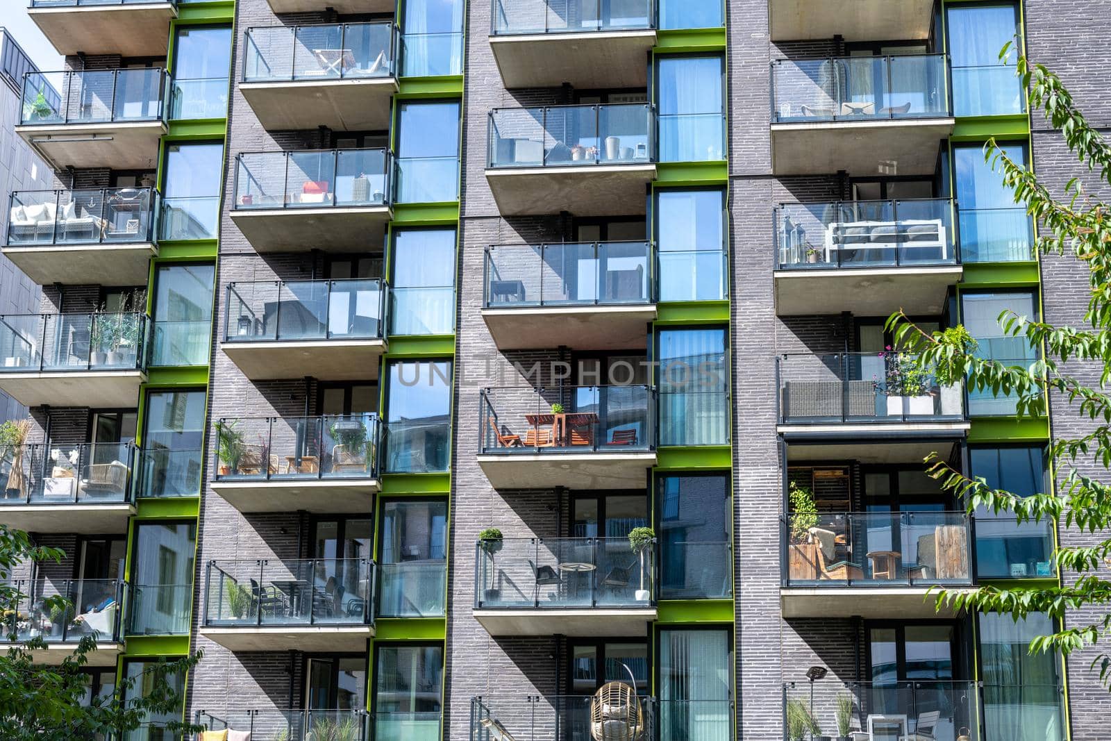 Detail of a modern apartment building with many balconies seen in Berlin, Germany