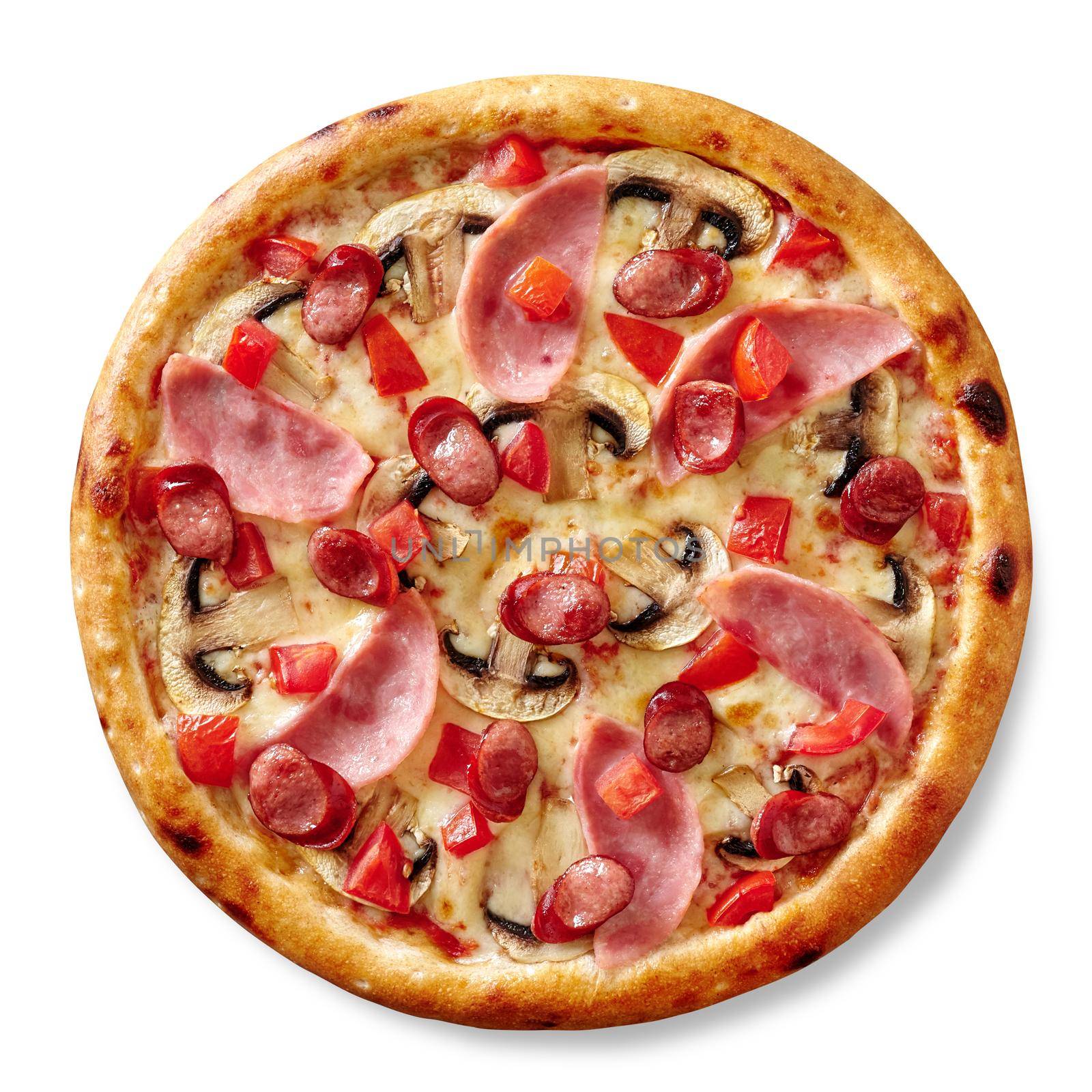 Whole freshly baked delicious pizza with melted mozzarella cheese and filling of ham slices, hunting sausages, mushrooms and fresh tomatoes, top view on white background