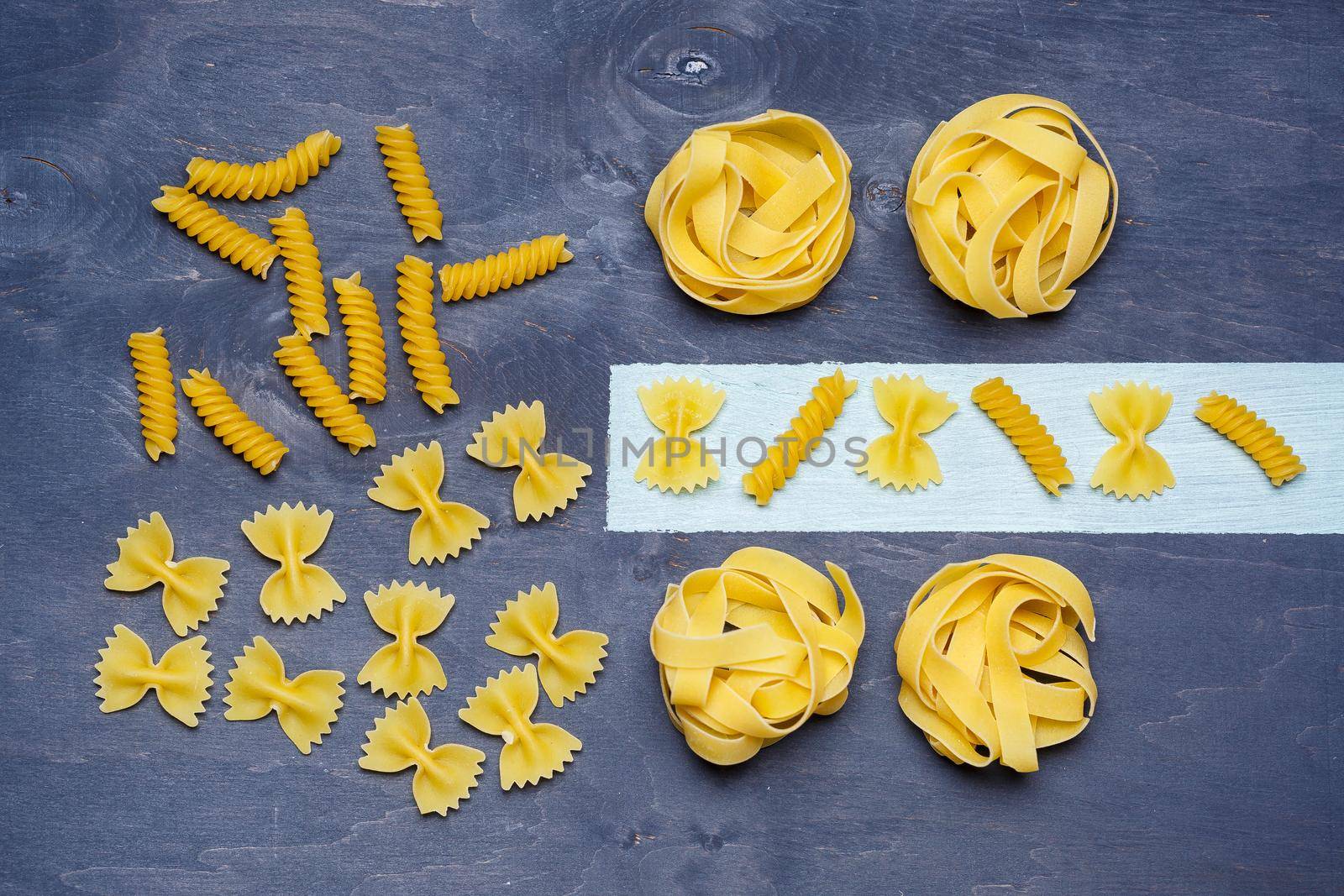 Pasta with durum wheat. Food for vegans. Proper nutrition, healthy food. Gray background