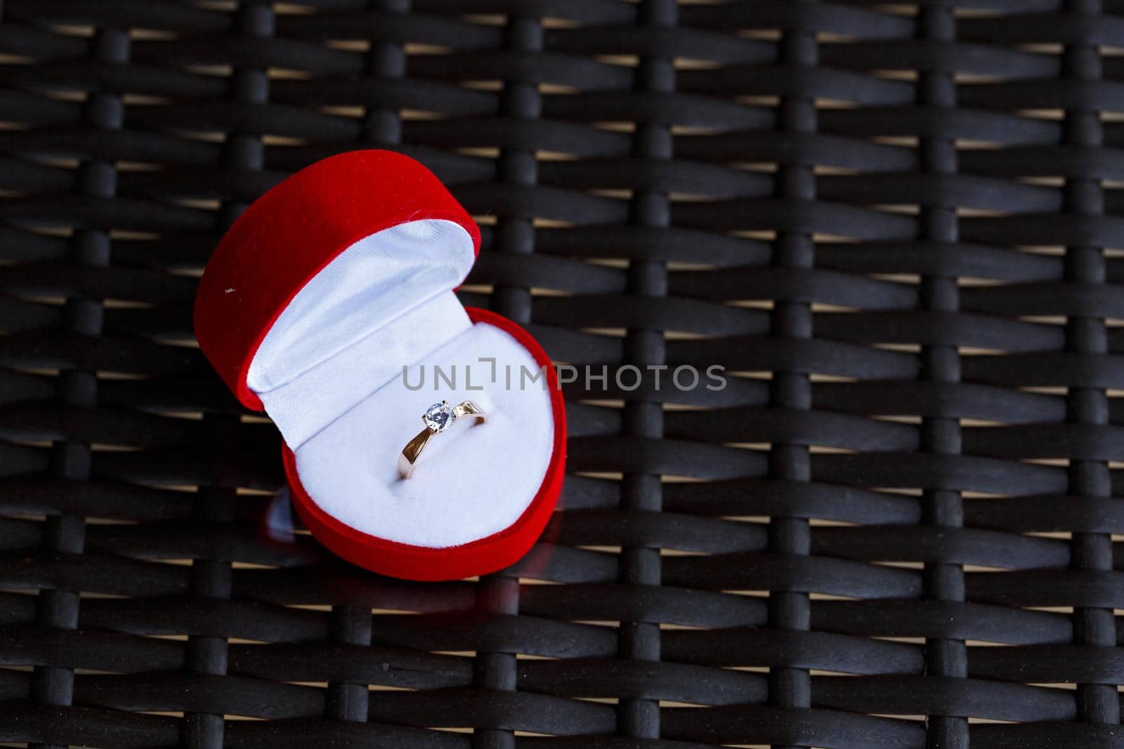 Engagement gold precious jewelry ring for a girl in a red box