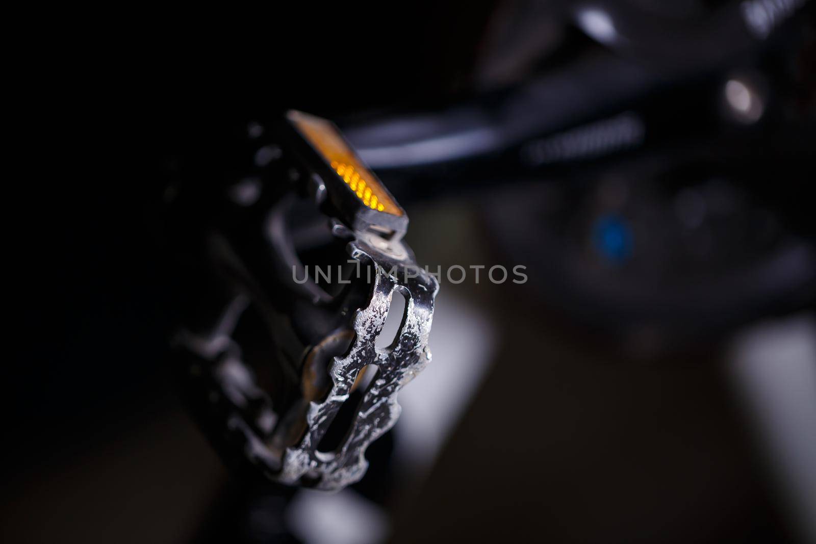 Black metal pedal on a bike with hard light. Bike accessories