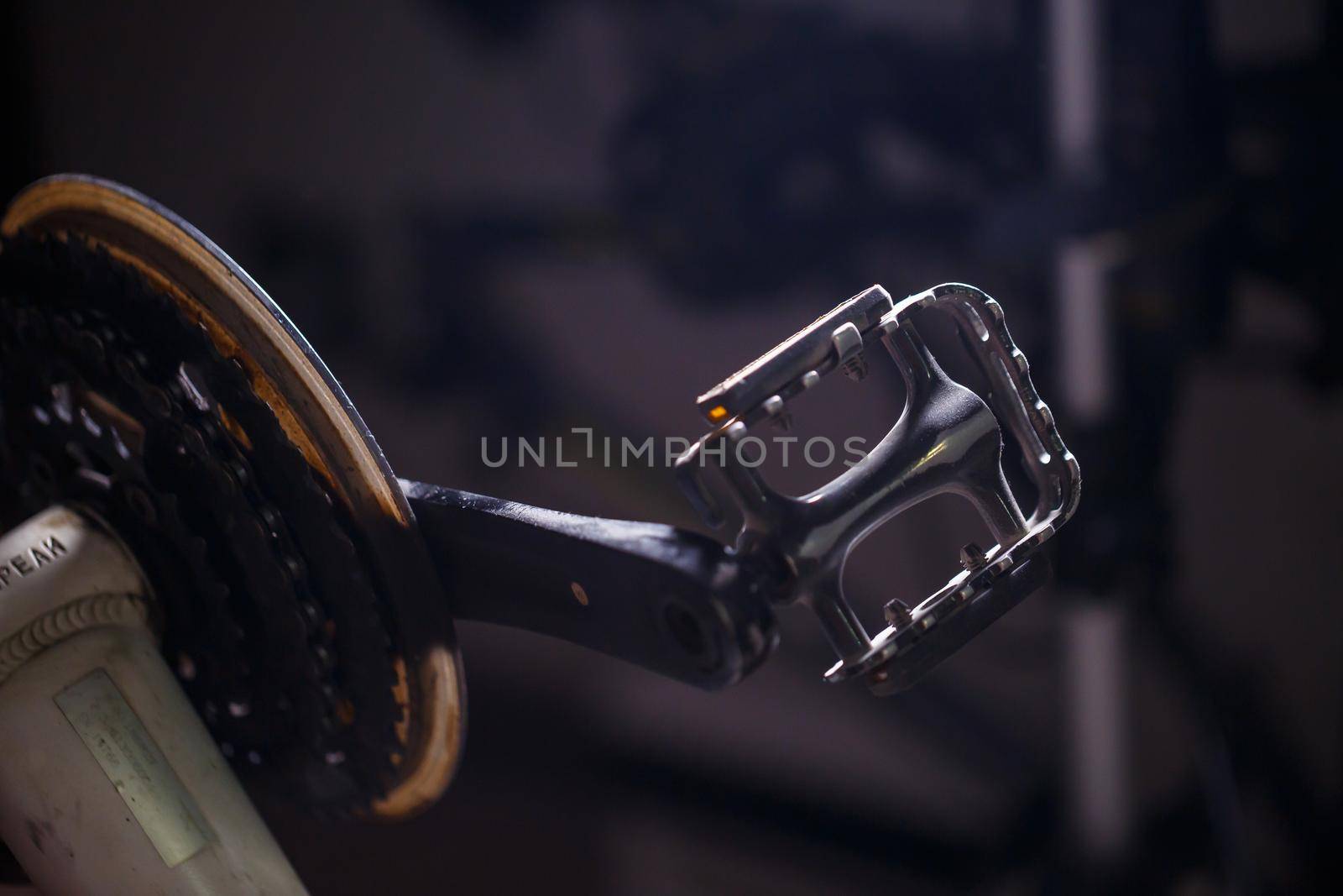 Black metal pedal on a bike with hard light. Bike accessories