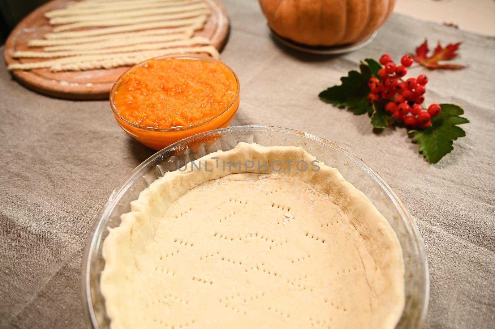 Selective focus. Top view of fresh raw ingredients for making traditional pumpkin classic pie with crispy crust. Copy advertising space. Thanksgiving Day and Halloween concept. Autumn holidays