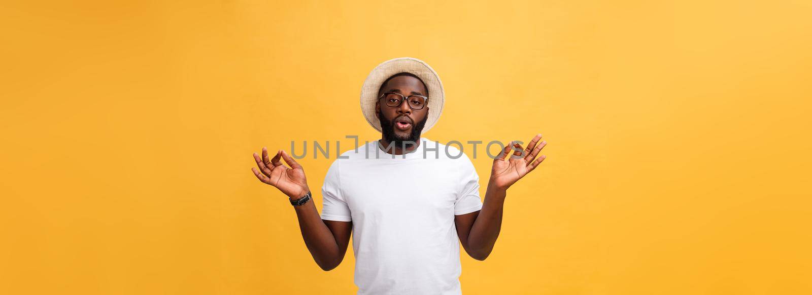 Closeup portrait of happy handsome, young man in meditation yoga mode, isolated on yellow background. Stress relief techniques concept. by Benzoix