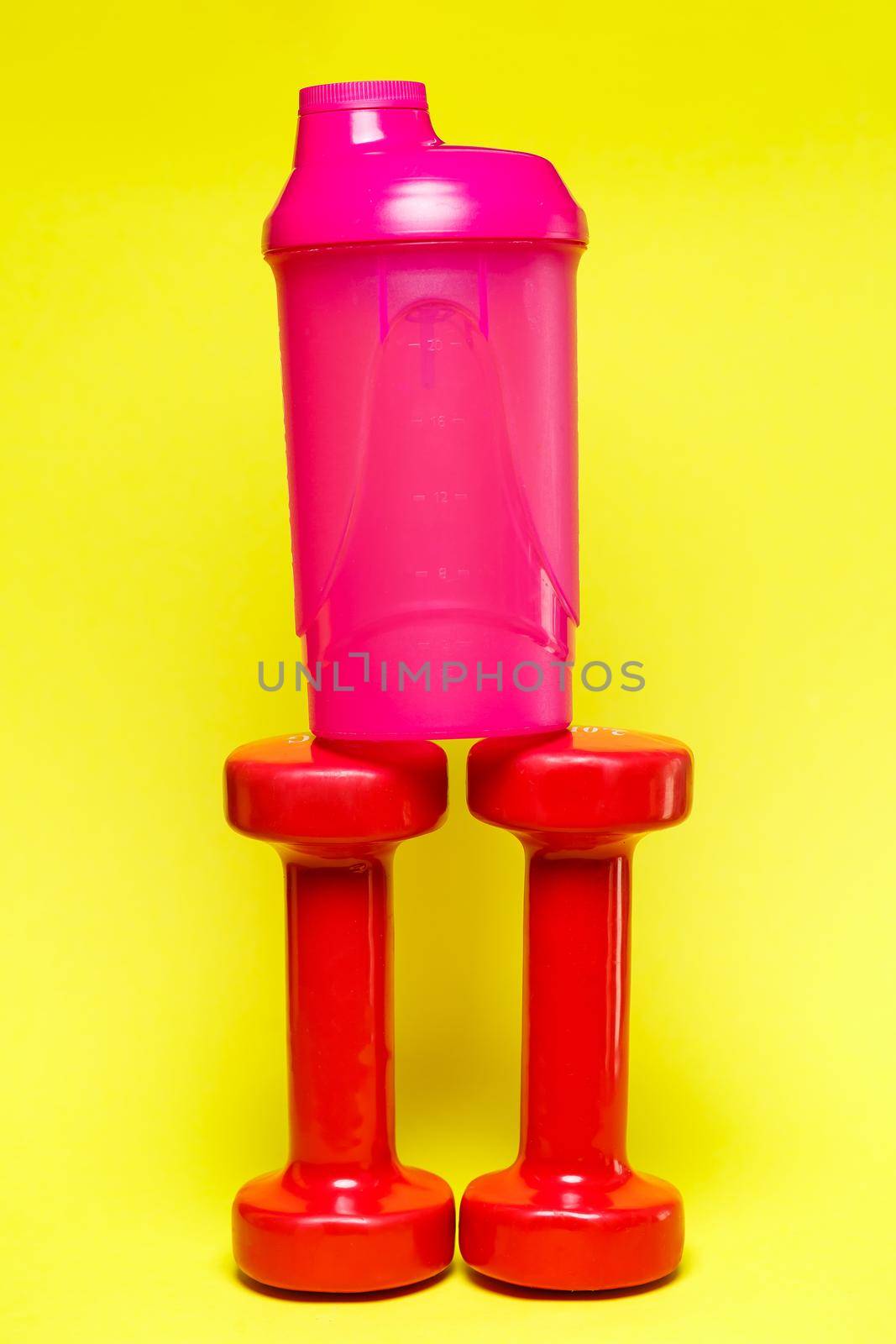 red dumbbells, pink shaker, colored background, sports, energy drink, gym equipment