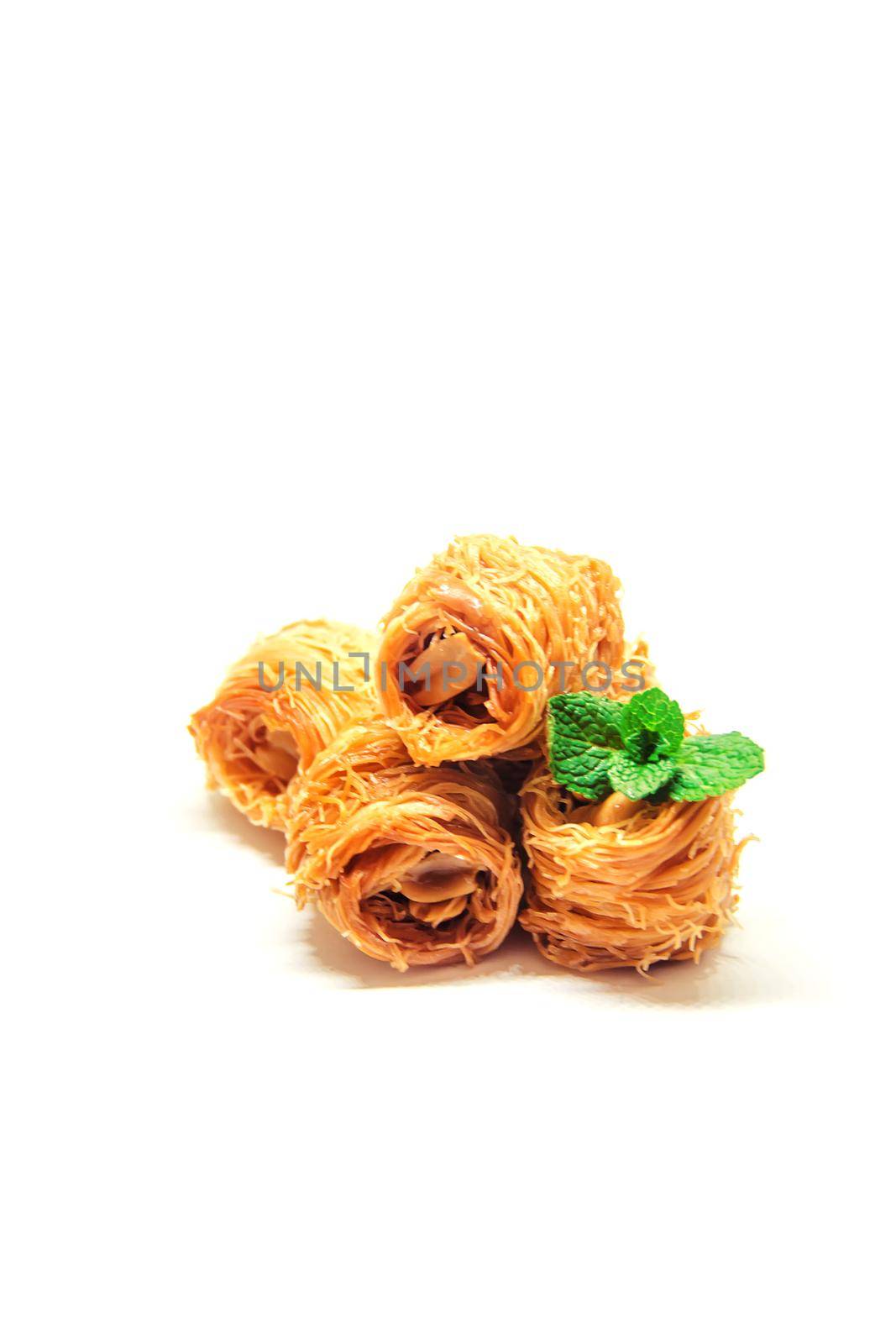 Eastern sweetness, baklava with peanuts and honey. Isolate. Selective focus. nature