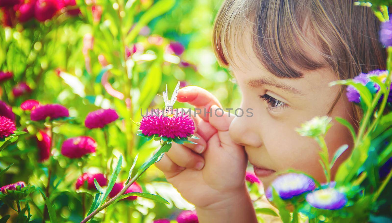 Child with a butterfly. Selective focus. nature and child.