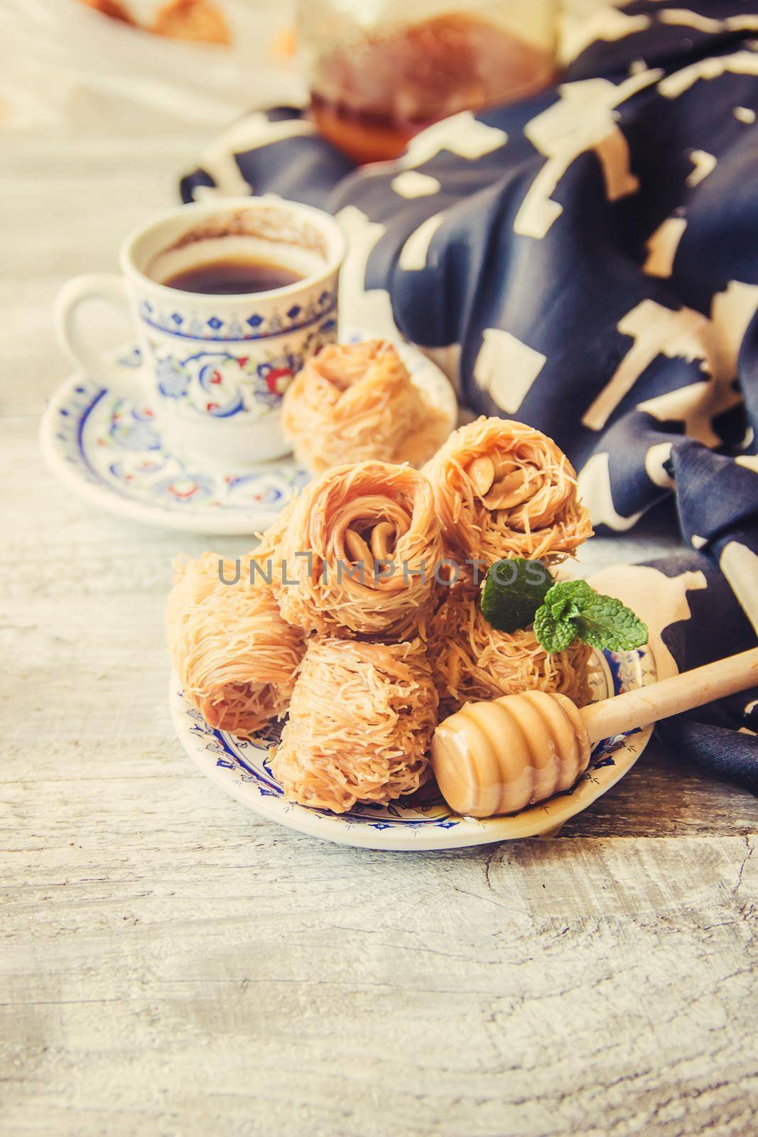 Eastern sweetness, baklava with peanuts and honey. Isolate. Selective focus. by yanadjana