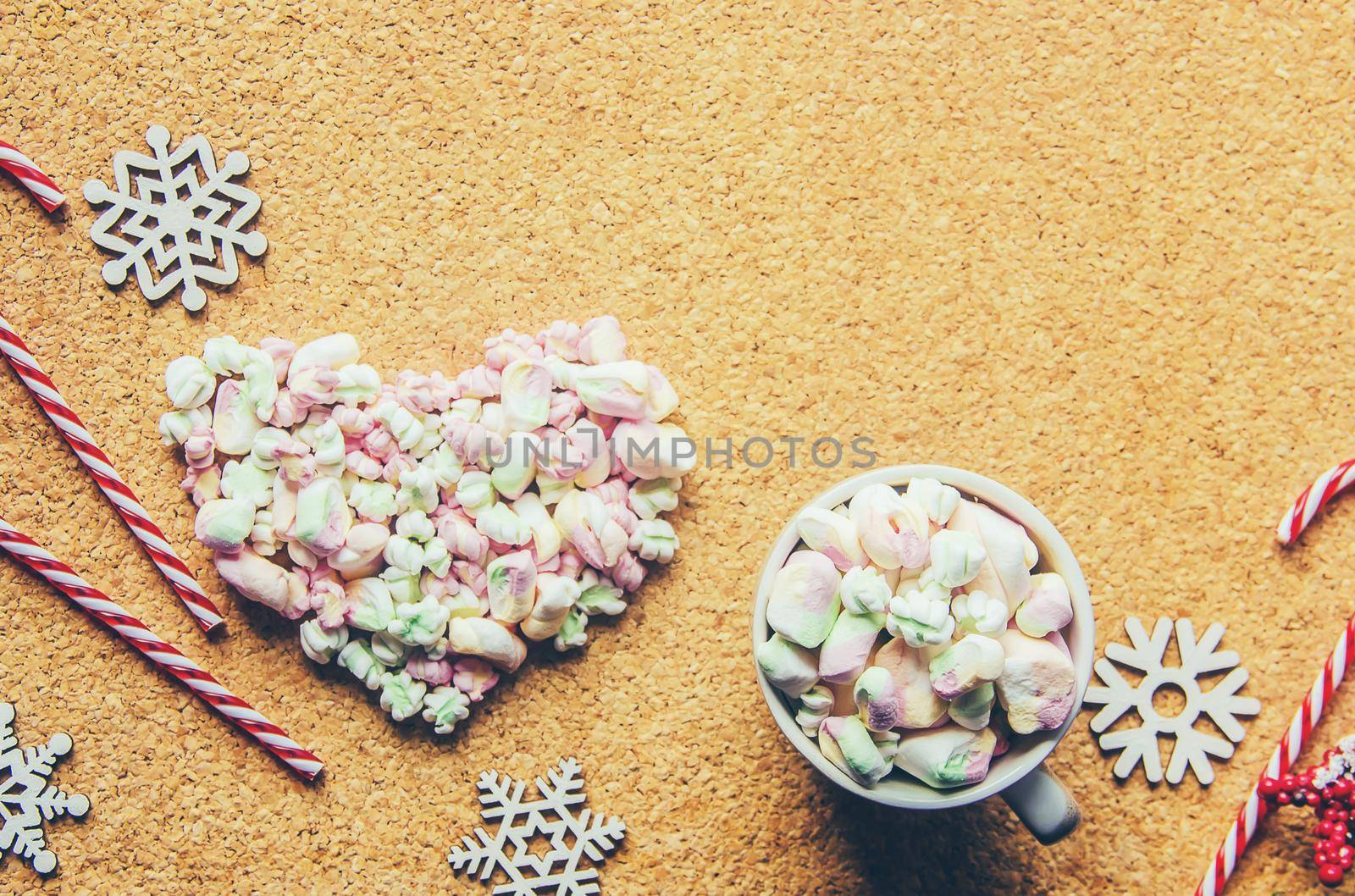 Hot chocolate and marshmallow on christmas background. Selective focus.