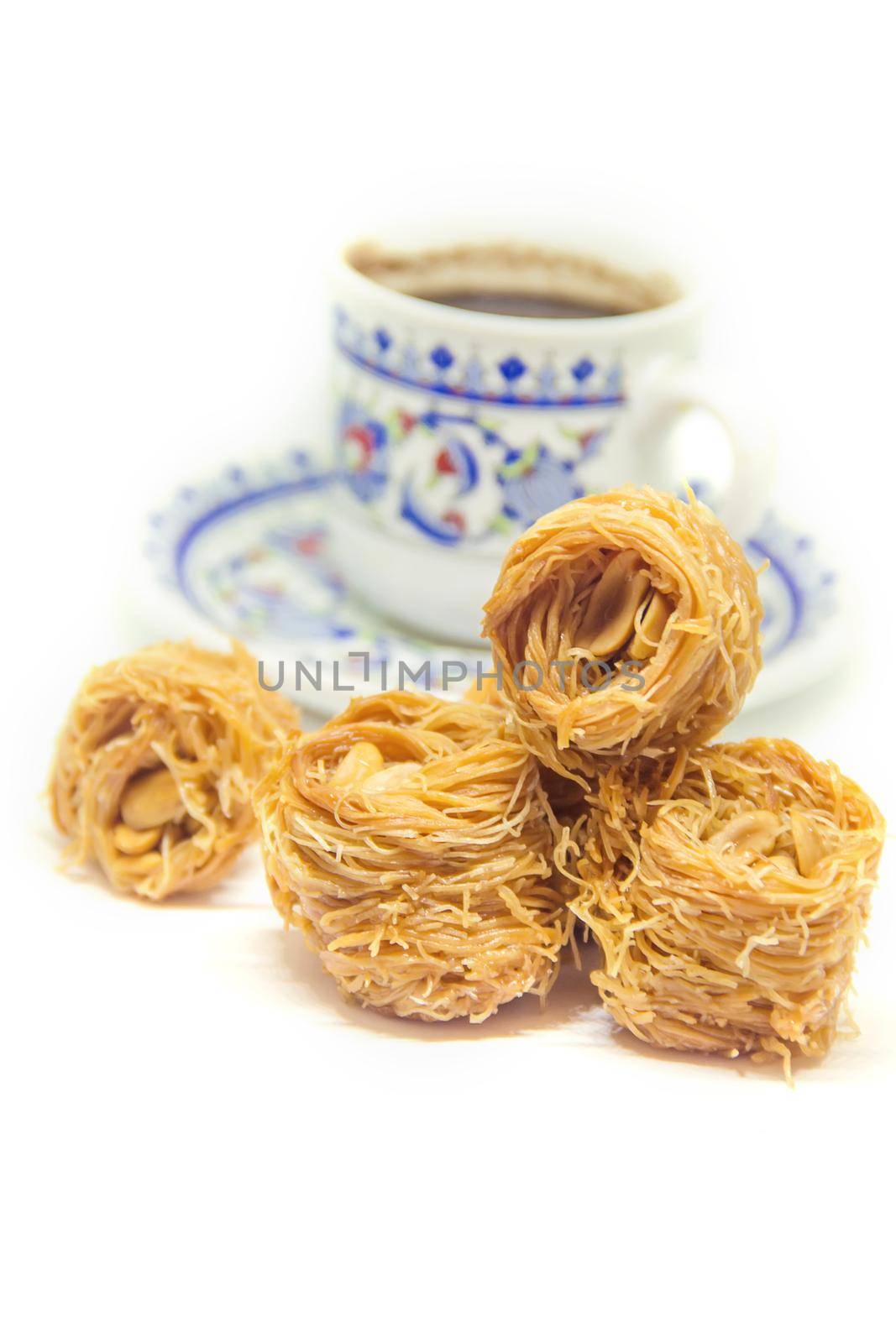 Eastern sweetness, baklava with peanuts and honey. Isolate. Selective focus. by yanadjana