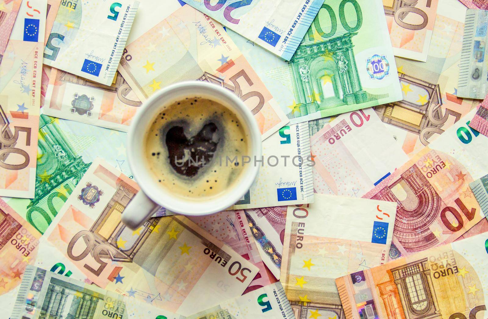 Texture of banknotes and a cup of coffee. Money. Selective focus.