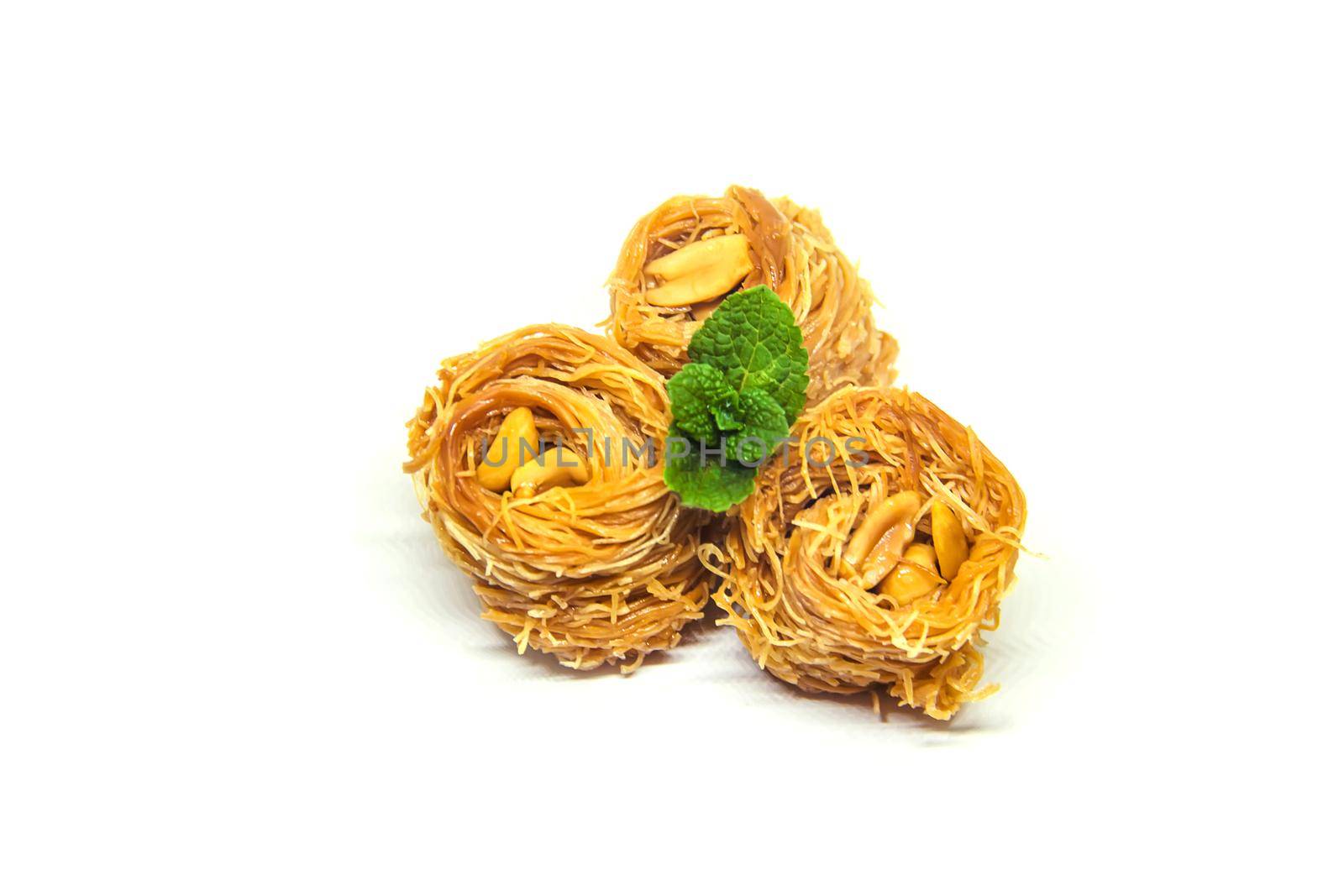 Eastern sweetness, baklava with peanuts and honey. Isolate. Selective focus. nature