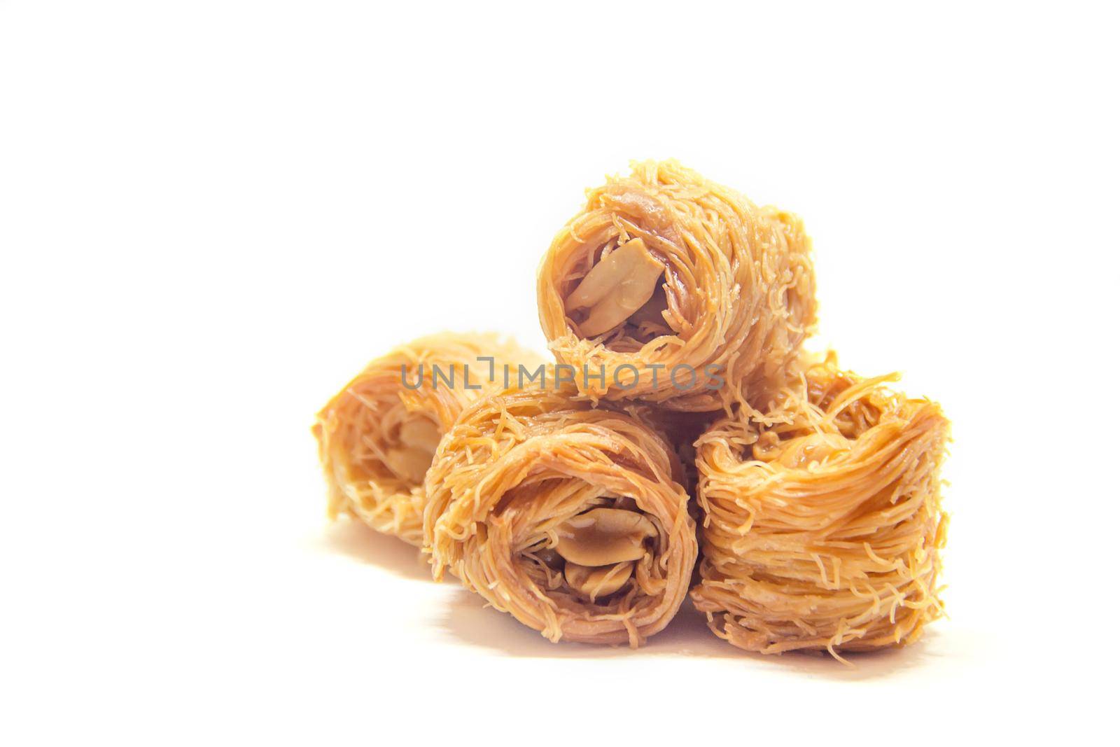 Eastern sweetness, baklava with peanuts and honey. Isolate. Selective focus. Food.