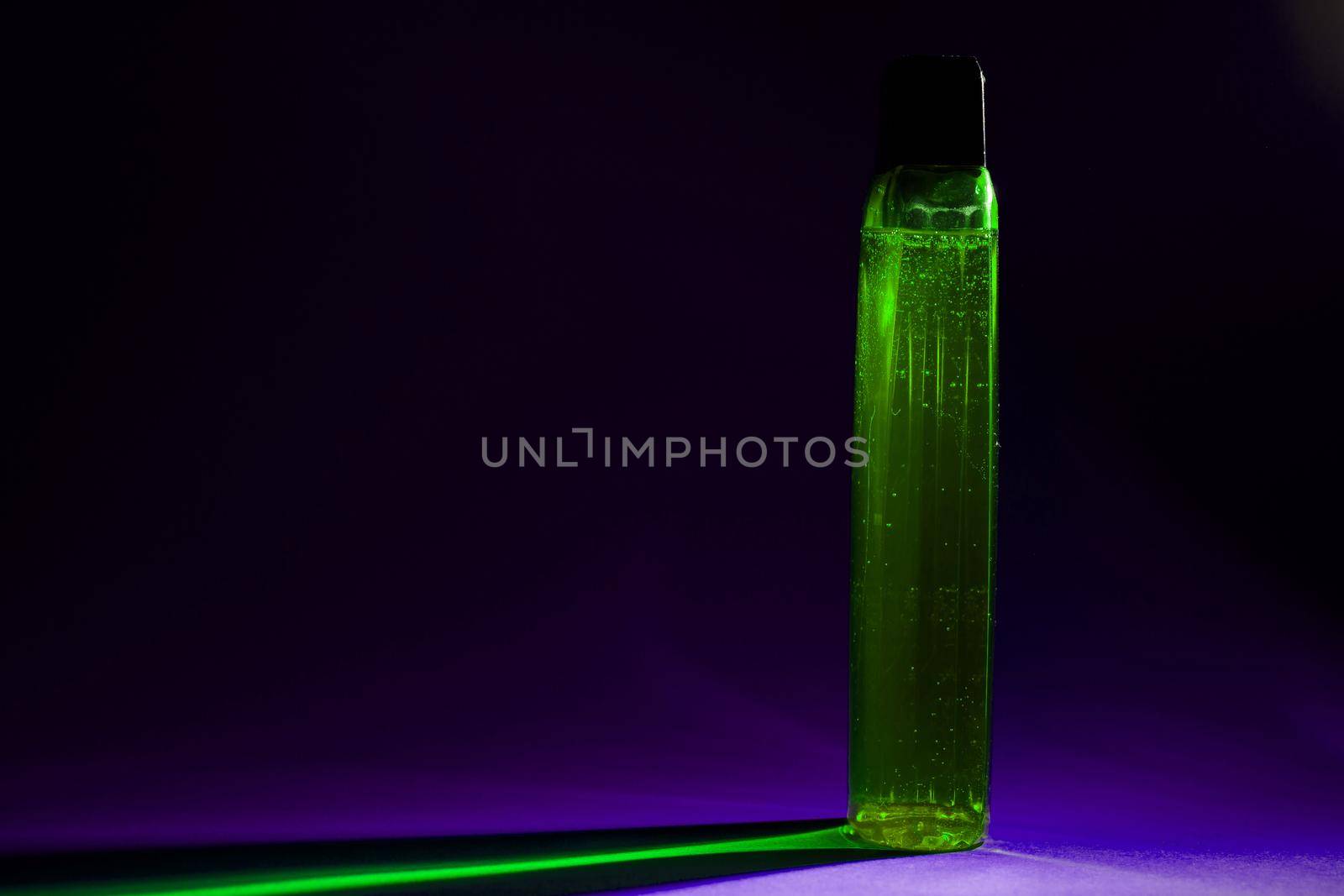 bottle with cream, shampoo for hair, shower gel, colored background, beautiful studio light, beauty and youth of the human body