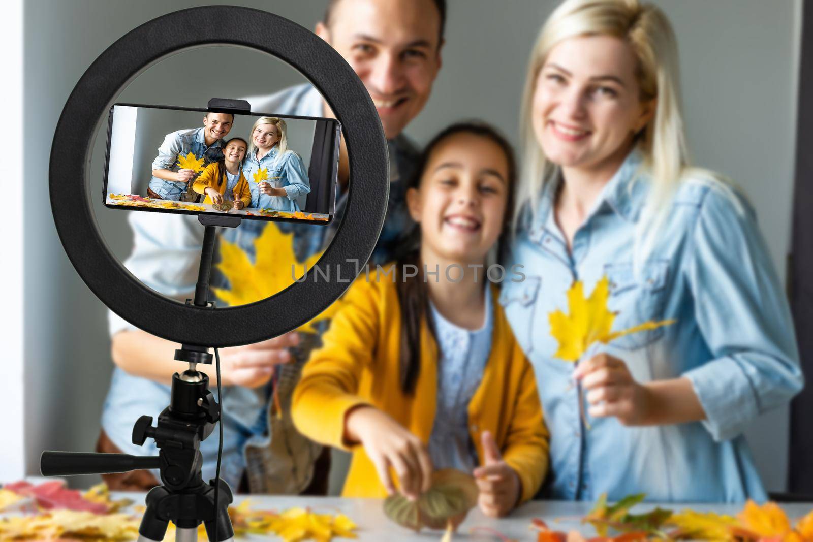 Photo of cheerful family happy positive smile make selfie record video enjoy time together sit couch indoors. by Andelov13