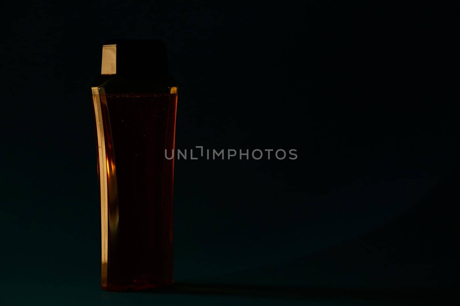 bottle with cream, shampoo for hair, shower gel, colored background, beautiful studio light, beauty and youth of the human body