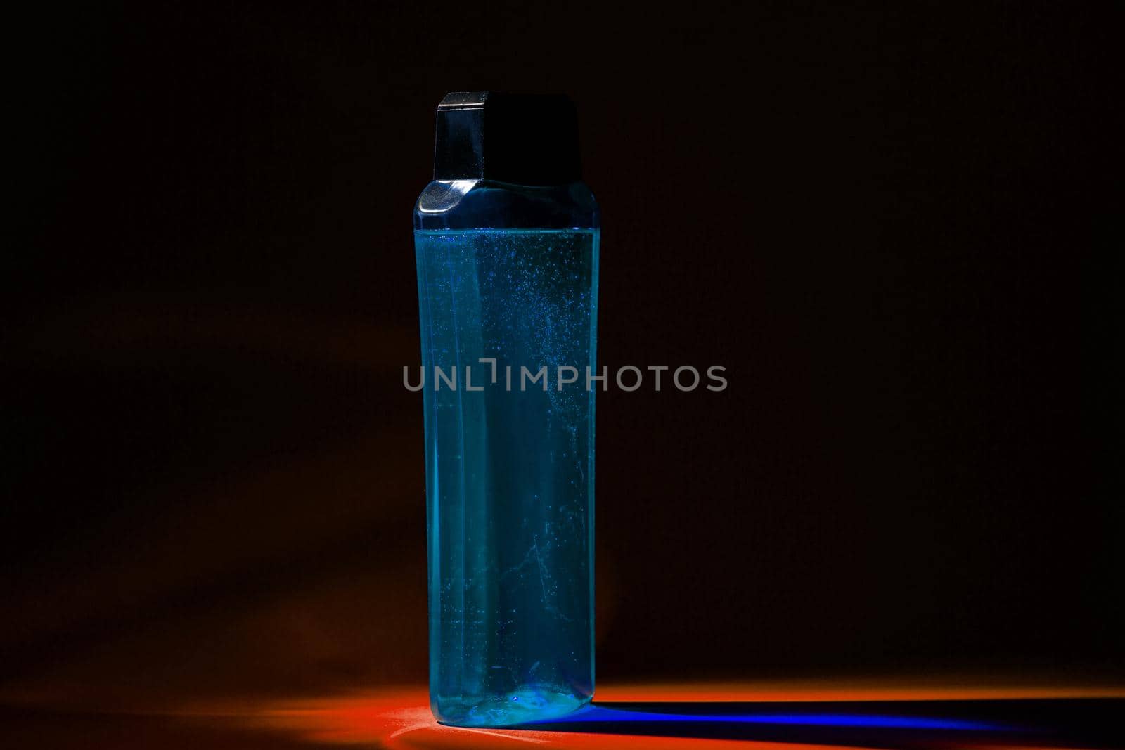 bottle with cream, shampoo for hair, shower gel, colored background, beautiful studio light, beauty and youth of the human body