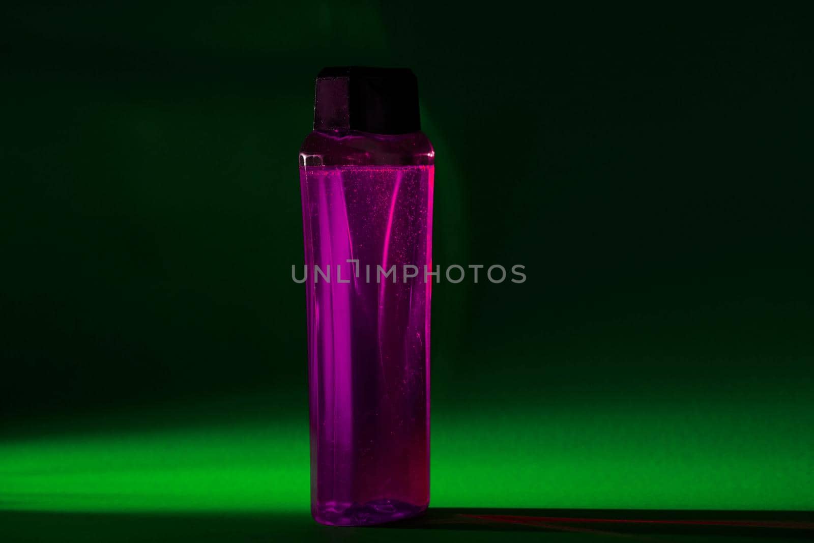 bottle with cream, shampoo for hair, shower gel, colored background, beautiful studio light, beauty and youth of the human body