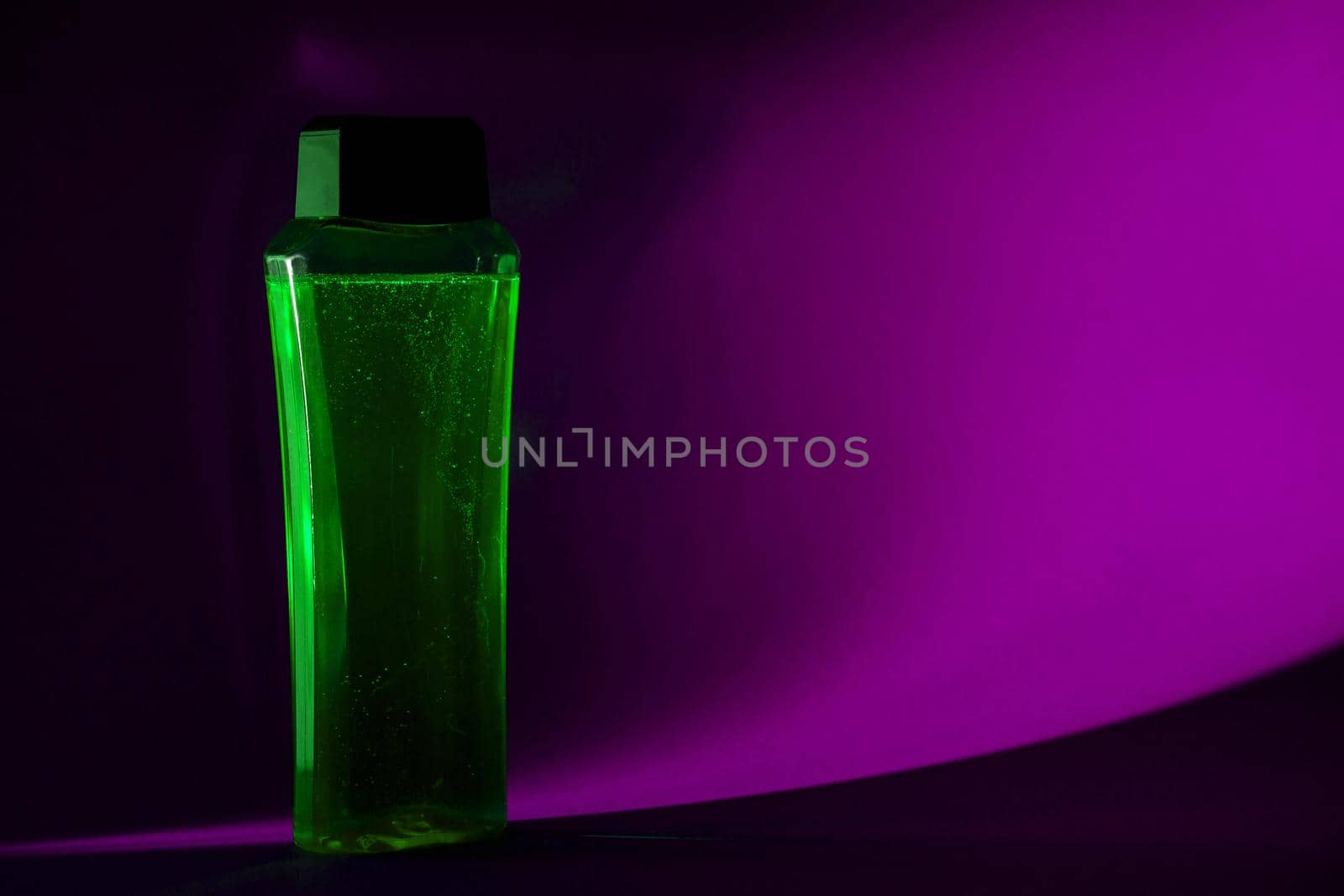 bottle with cream, shampoo for hair, shower gel, colored background, beautiful studio light, beauty and youth of the human body