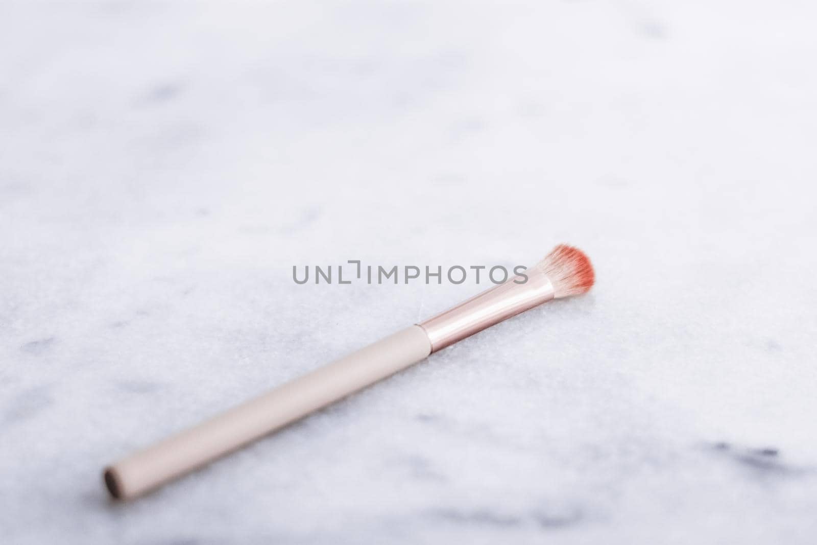 Cosmetic branding, blog and girly concept - Make-up brush for foundation base face contouring on marble background, mua cosmetics as glamour makeup artist product for luxury beauty brand art design