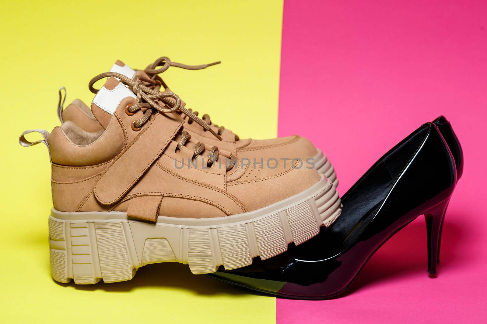 Fashionable women's shoes. Big brown leather shoes and black patent leather shoes.