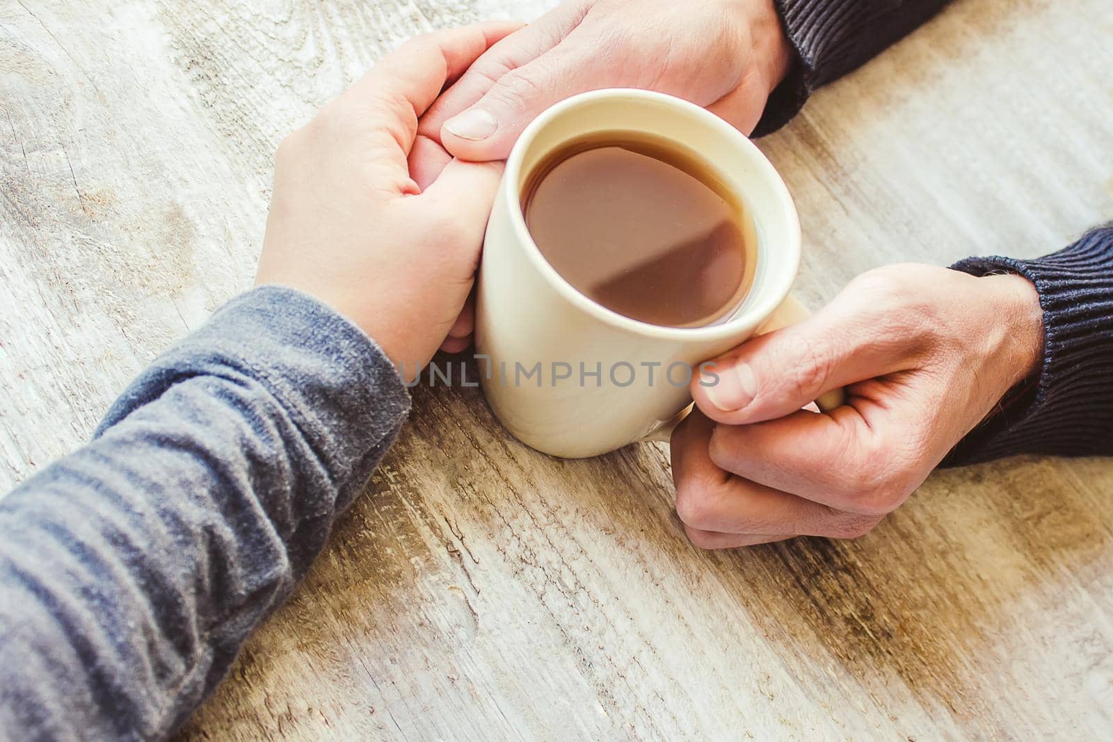 Tea in hand. The lovers are together. Selective focus. by yanadjana