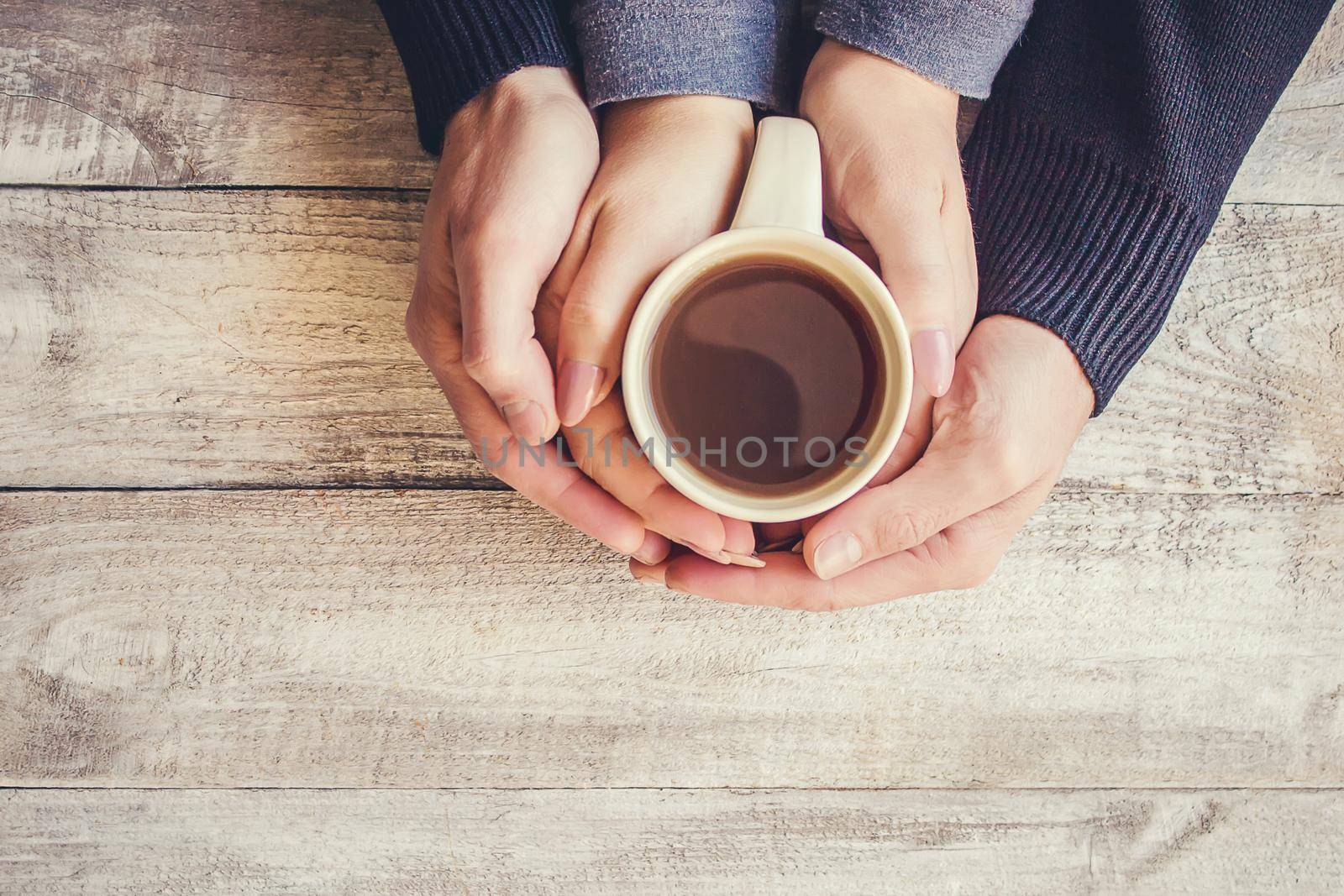 Tea in hand. The lovers are together. Selective focus. by yanadjana