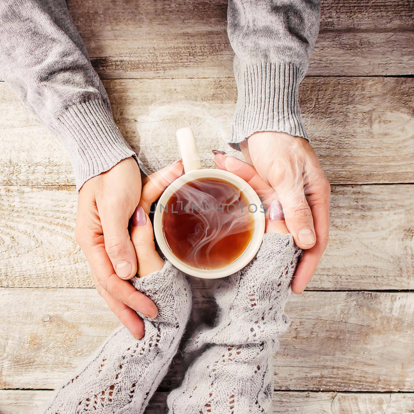 Cup drink for Breakfast in the hands of lovers. Selective focus. Nature.