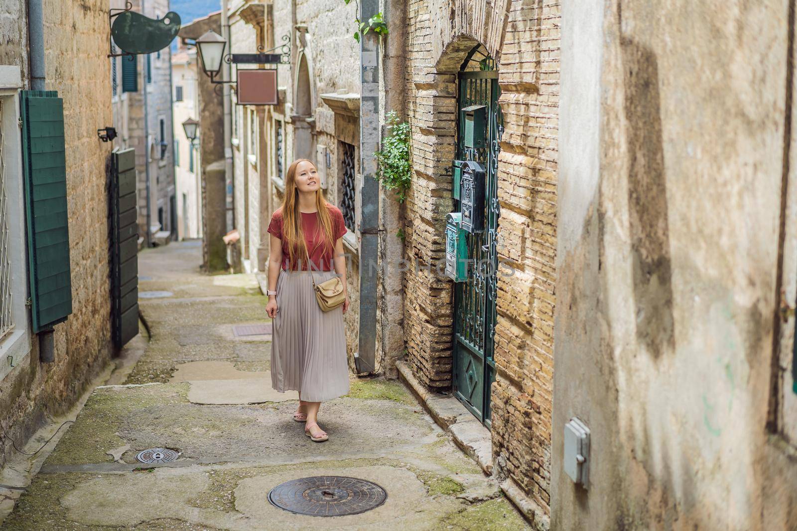 Woman tourist in Herceg Novi old town. Historical and touristic center of Herceg Novi. Montenegro.