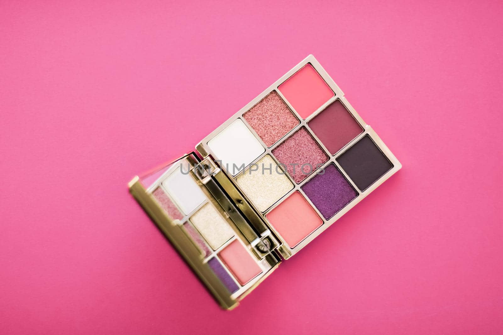 Cosmetic branding, mua and girly concept - Eyeshadow palette and make-up brush on rose background, eye shadows cosmetics product for luxury beauty brand promotion and holiday fashion blog design