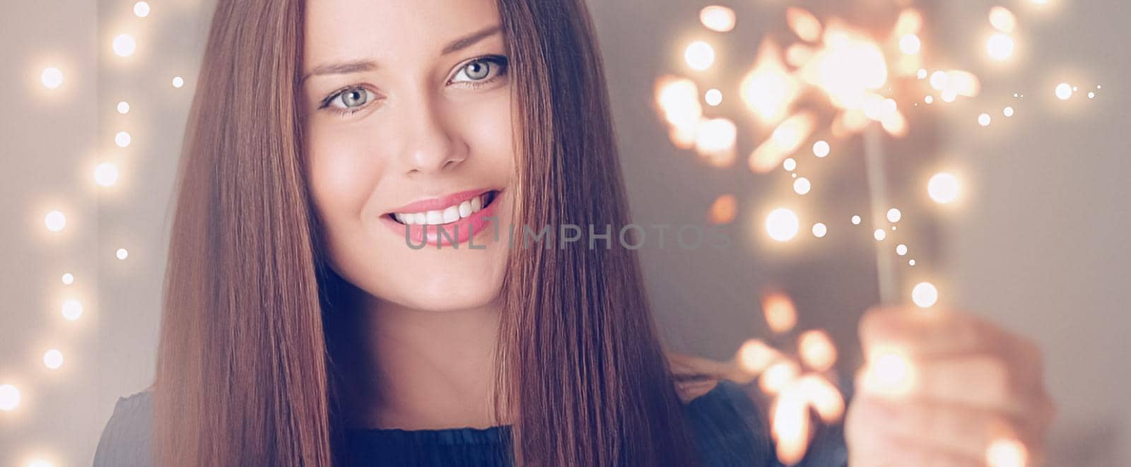 Holiday magic, Christmas and New Year celebration, happy woman with sparklers, portrait