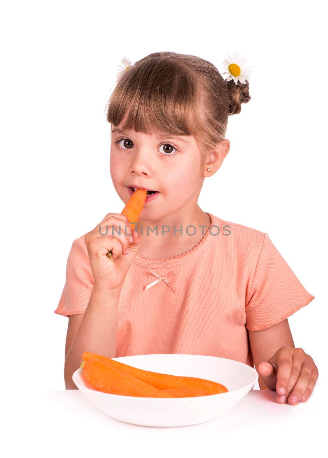 Cute little girl with the carrot on a white background by aprilphoto