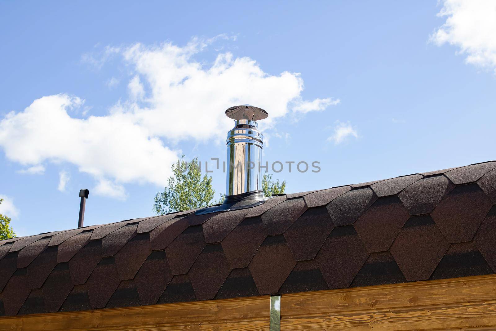 Metal stove pipe on the roof close up