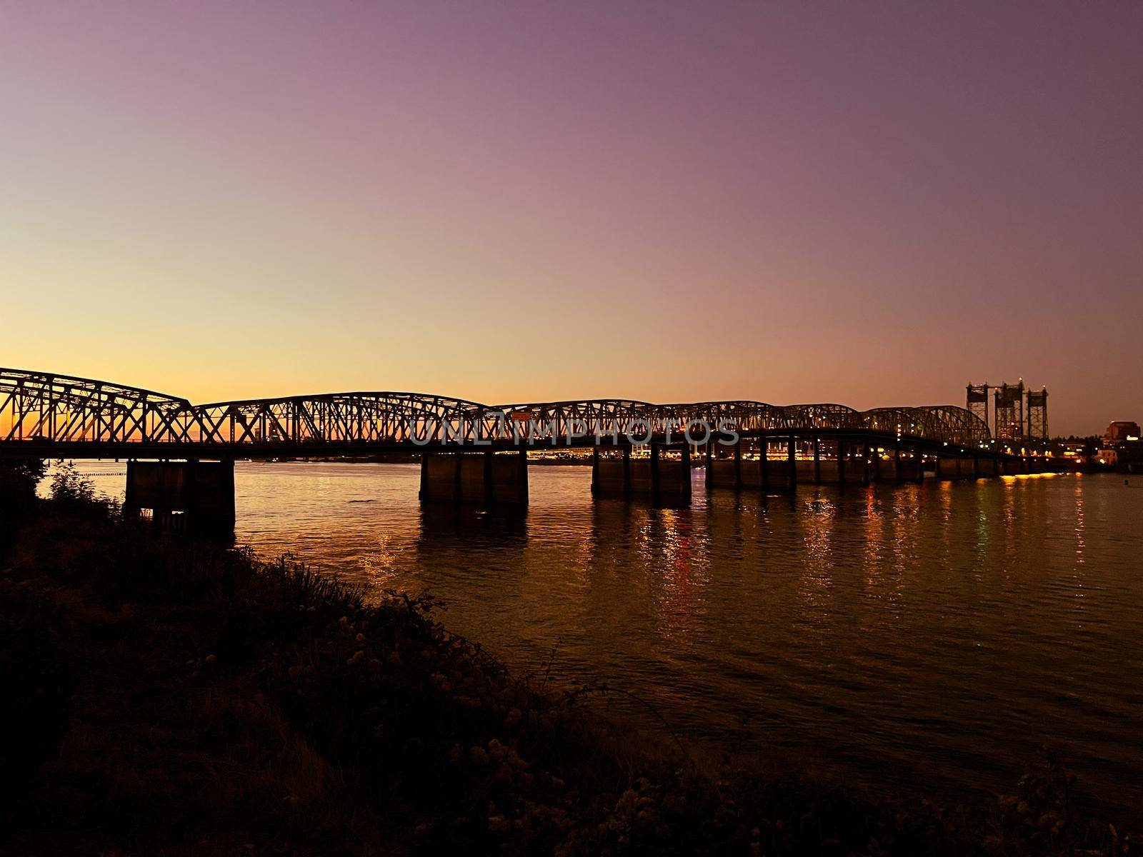 Drone footage of Oregon - Washington Interstate Bridge In Portland and Vancouver over the Columbia River water way. High quality 4k footage