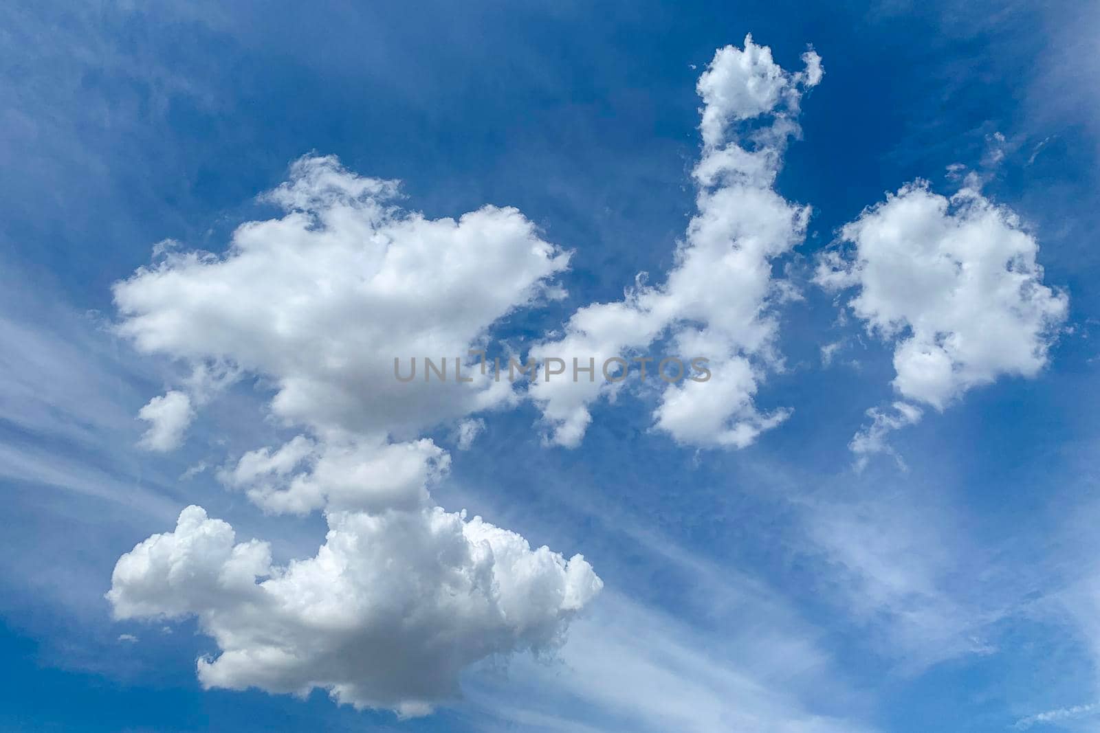 White clouds in blue sky. Beautiful fluffy clouds on blue heaven background. by Khosro1