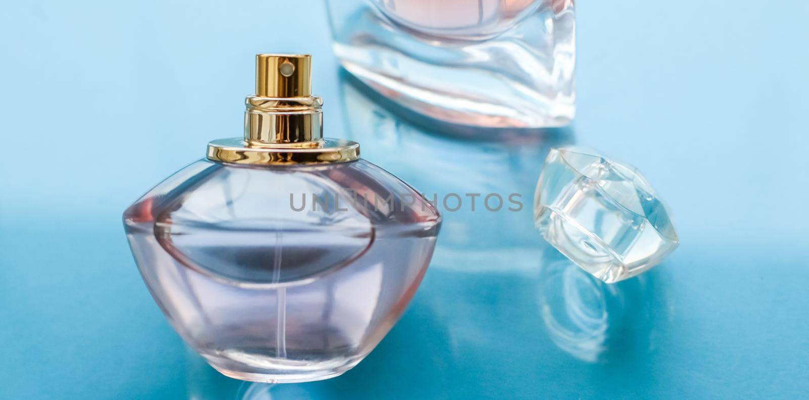 Pink perfume bottle on glossy background, sweet floral scent, glamour fragrance and eau de parfum as holiday gift and luxury beauty cosmetics brand design by Anneleven