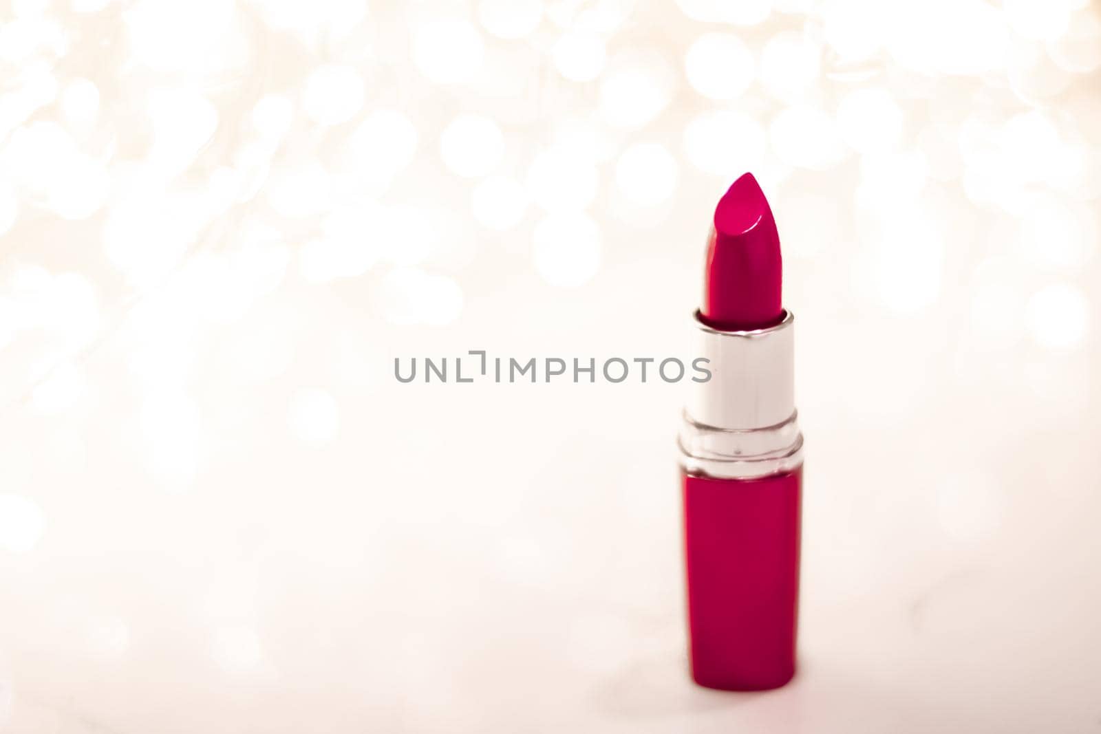 Cosmetic branding, sale and glamour concept - Maroon lipstick on golden Christmas, New Years and Valentines Day holiday glitter background, make-up and cosmetics product for luxury beauty brand