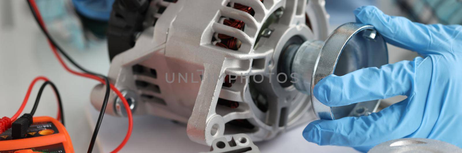 Replacement and testing of alternator and diagnostic equipment closeup. Car parts diagnostics concept