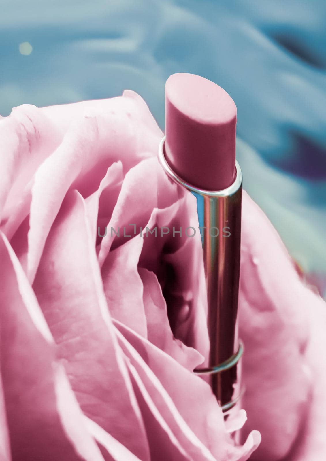 Cosmetic branding, luxe and fashion concept - Pink lipstick and rose flower on liquid background, waterproof glamour make-up and lip gloss cosmetics product for luxury beauty brand holiday design