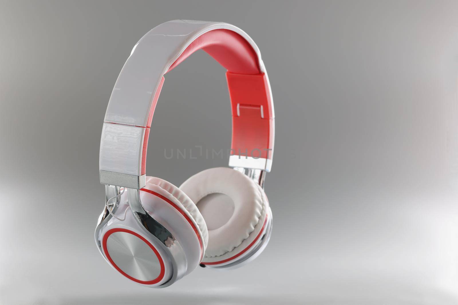 Gray bluetooth wireless headphones, close-up. Stylish accessory for listening to music. Clear sound headphone