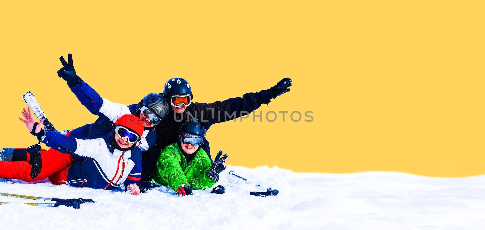 Smiling ski friends skiing alps resort.
