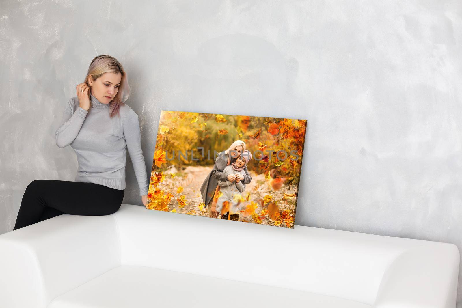 Canvas print with gallery wrap. woman hangs autumn photography, photocanvas by Andelov13
