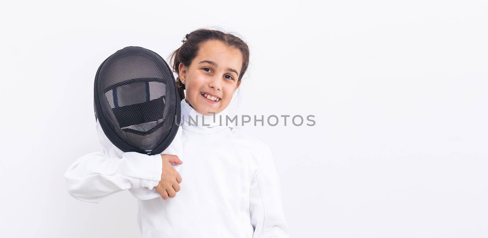 Little girl fencer with epee and mask.