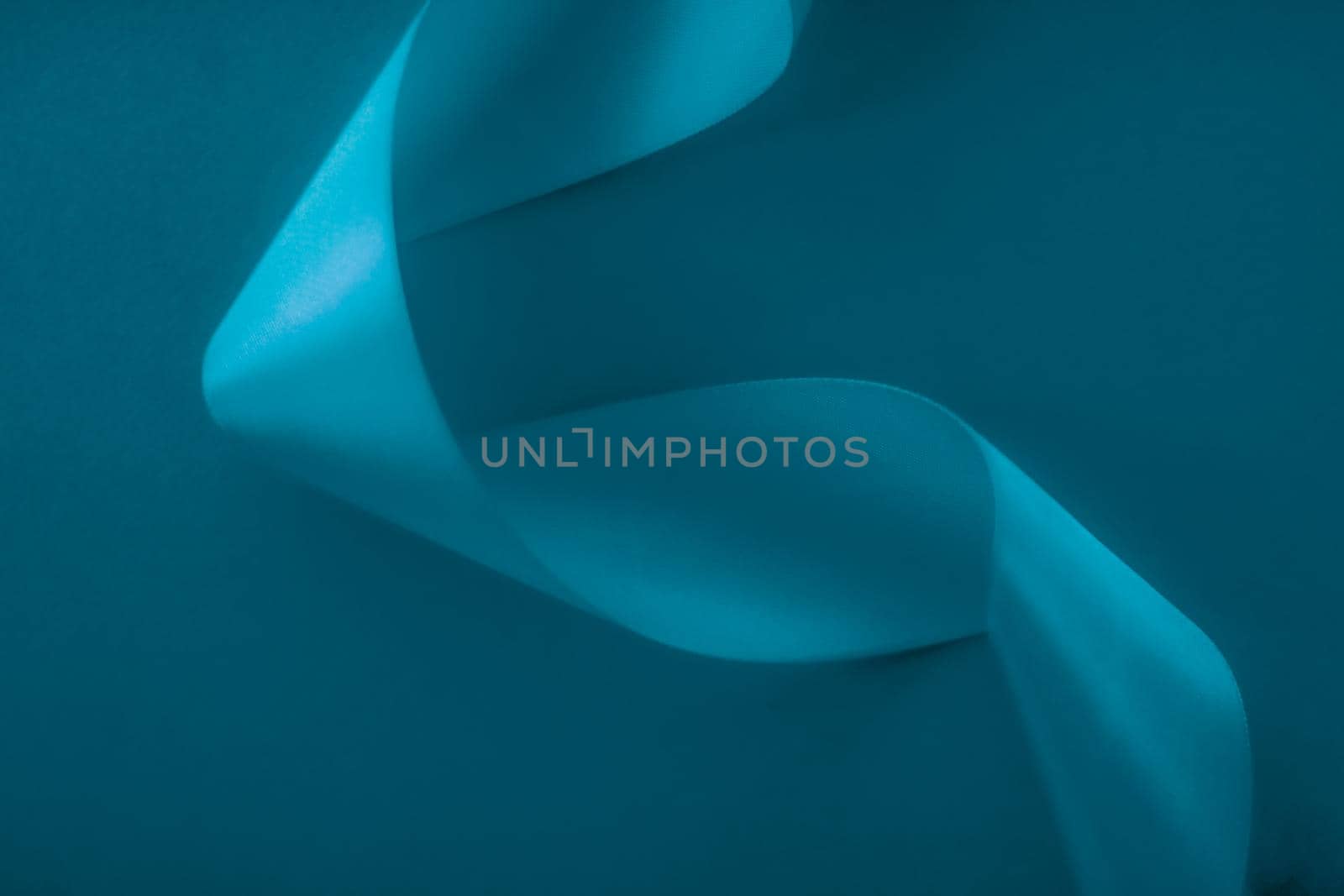 Branding, holidays and luxe brands concept - Abstract silk ribbon on aqua blue background, exclusive luxury brand design for holiday sale product promotion and glamour art invitation card backdrop